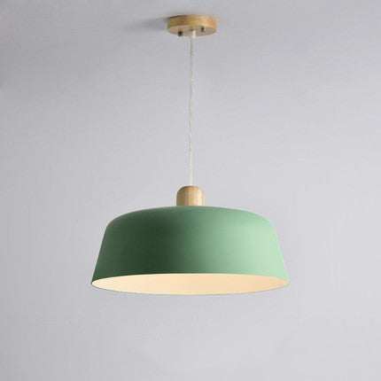 Nordic wood pendant lighting fixture in green, featuring a zinc alloy chandelier with adjustable height, ideal for kitchen or dining room décor.