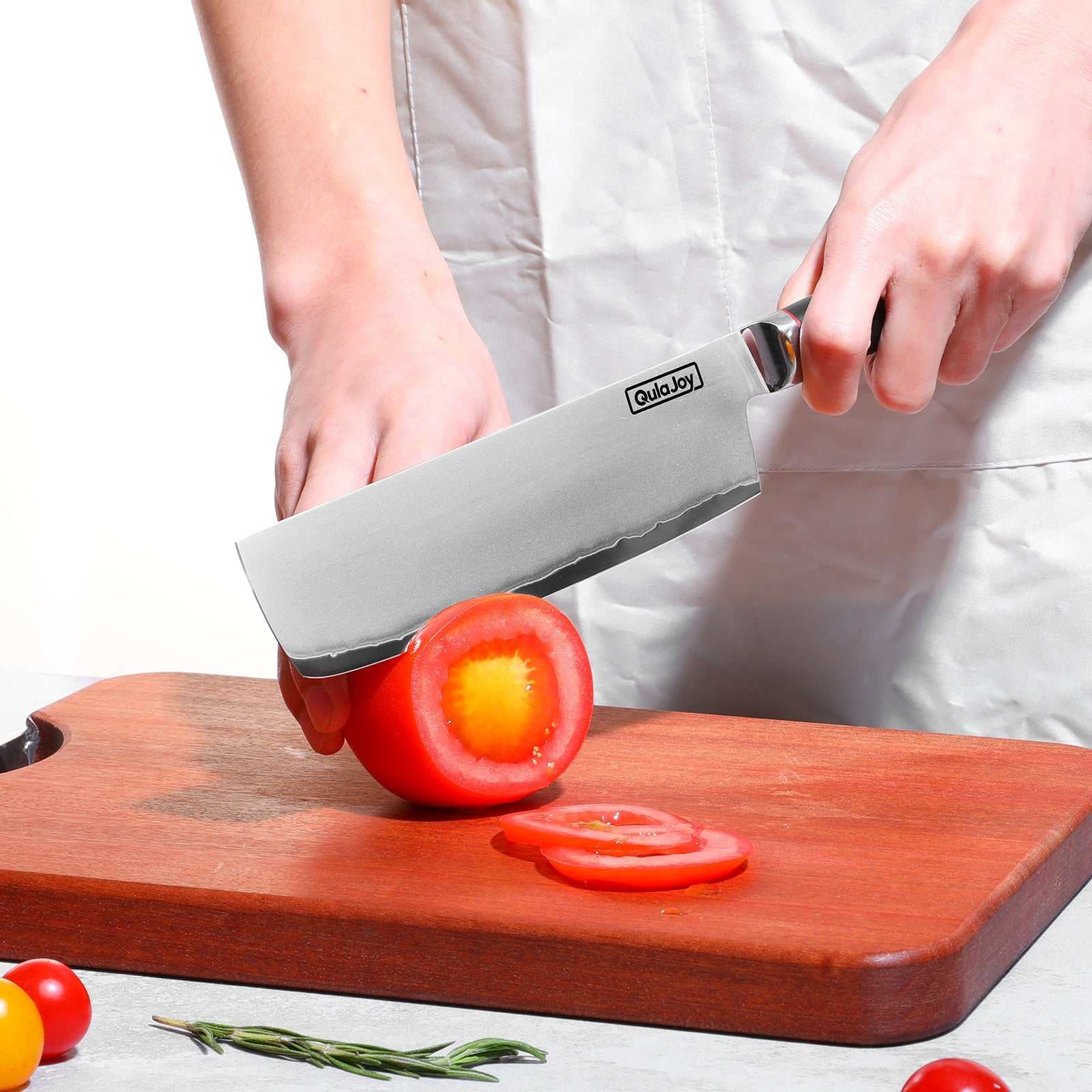 Qulajoy VG10 Chef Knife slicing tomato on wooden cutting board.