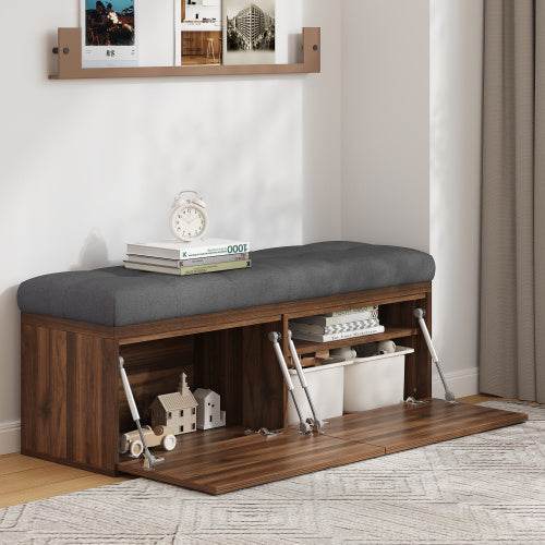 49-inch dark grey storage bench with padded seat, adjustable shelves, and double doors.
