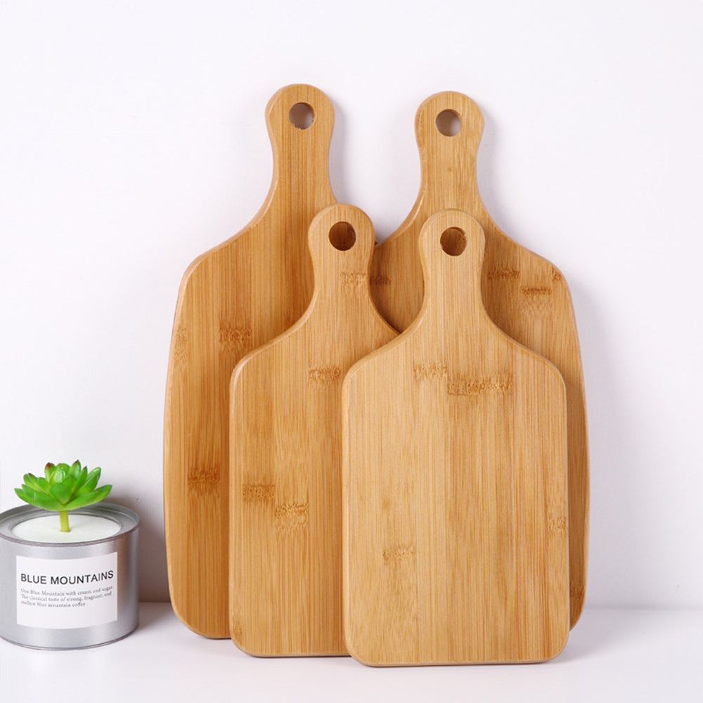Modern minimalist wooden cutting boards with handles for hanging, crafted from beech and bamboo with smooth lacquer finish, perfect for home use.