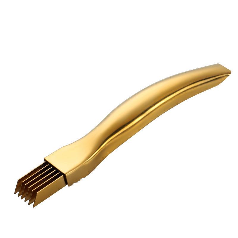 Gold metal kitchen onion knife grater with serrated edge for shredding.