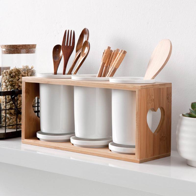 Nordic household ceramic chopstick holder with bamboo wooden frame.