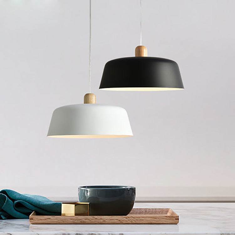 Nordic wood pendant lighting fixture in black and white above a kitchen counter, home decor.