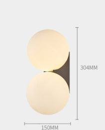 Nordic minimalist wall lamp with double circular glass shades and LED light source.