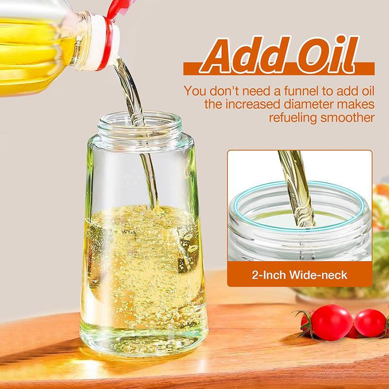 Glass oil sprayer with wide-neck design for easy filling; modern simplicity style in a kitchen setting.