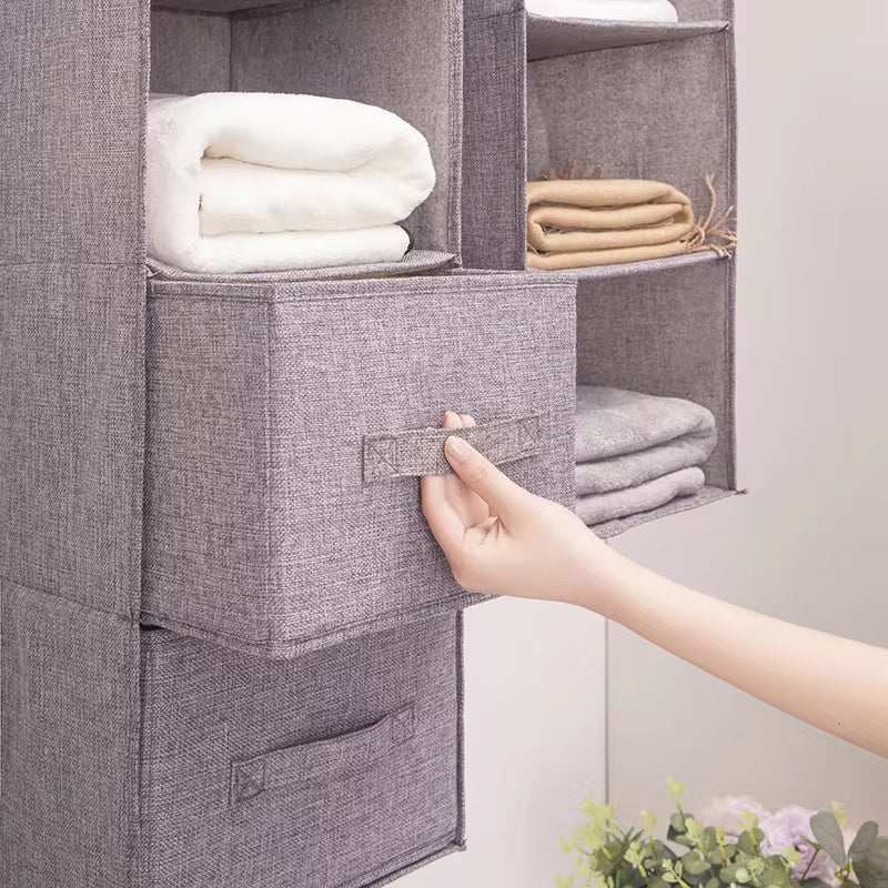 Hanging cotton cloth drawer storage closet with multiple layers in use.