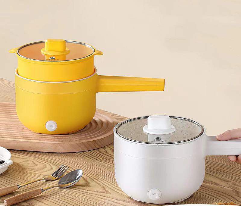 Multifunctional electric cooker with non-stick coating in yellow and white, suitable for dormitory use.