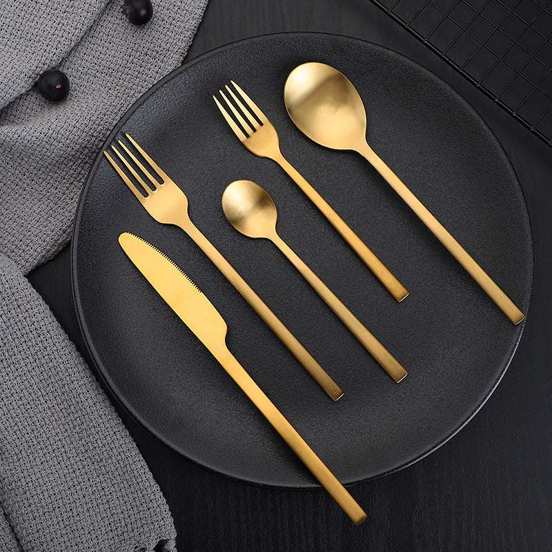 Gold stainless steel cutlery set with matte finish, featuring a simple and stylish design.