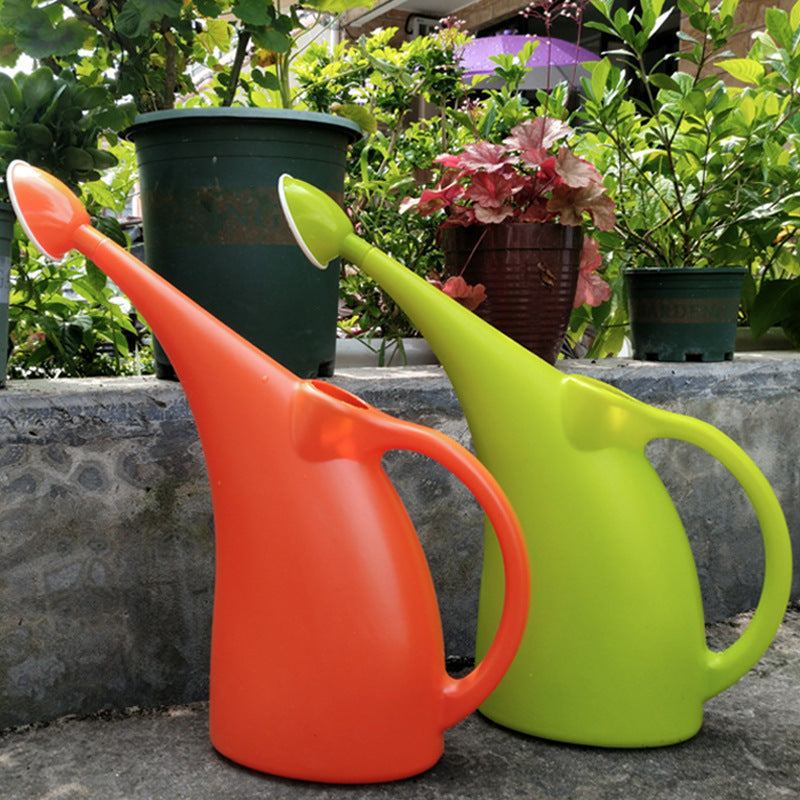 Colorful polypropylene watering cans for gardening with long spouts.