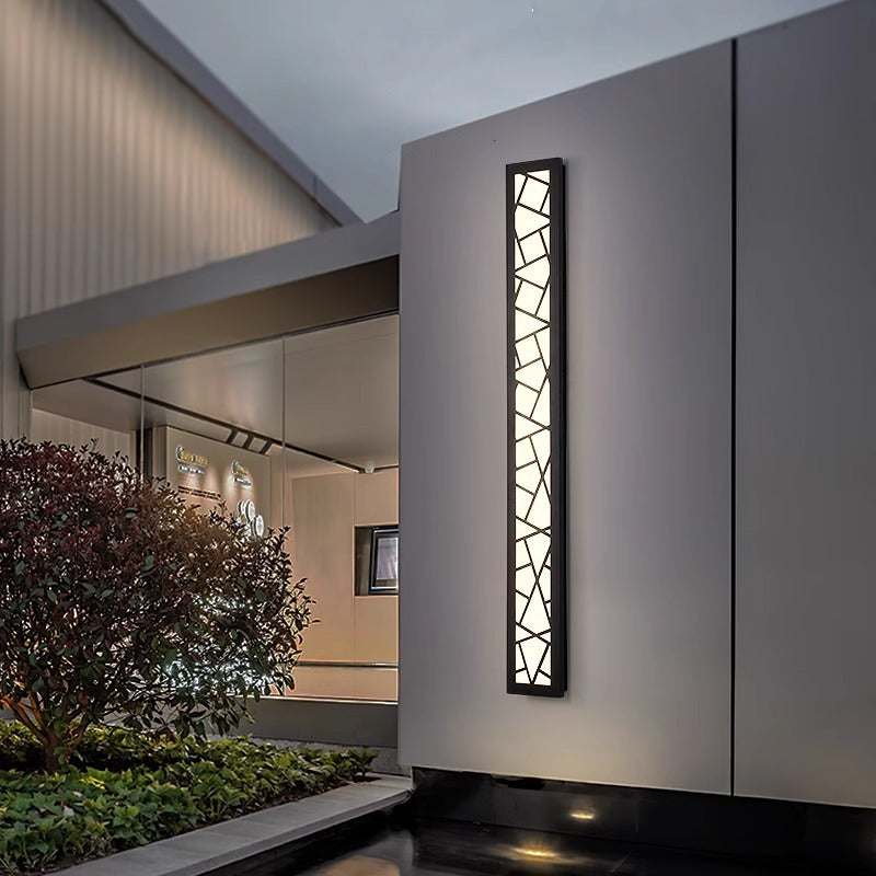 Outdoor waterproof wall lamp on modern villa exterior.