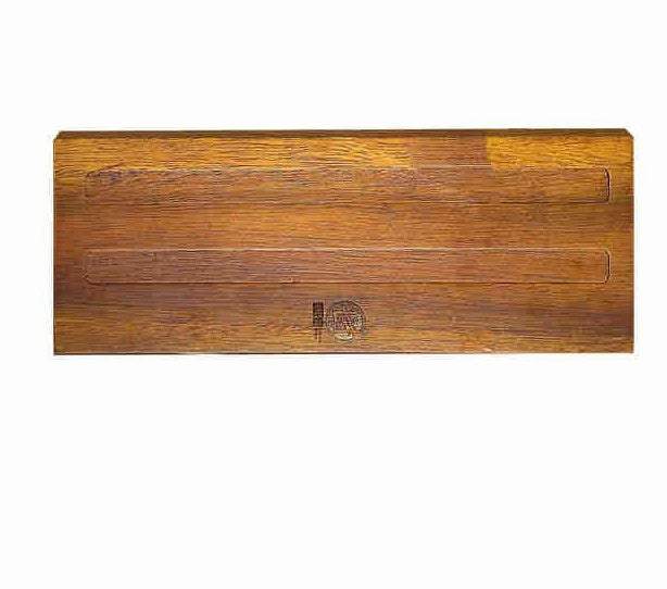 Solid wood wall-mounted magnetic kitchen knife rack.